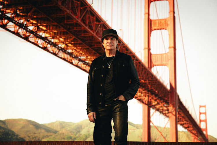 Lead singer of Train standing in front of the Golden Gate Bridge