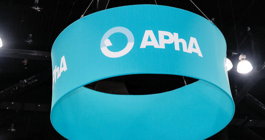 An APhA banner hanging over the exhibit hall
